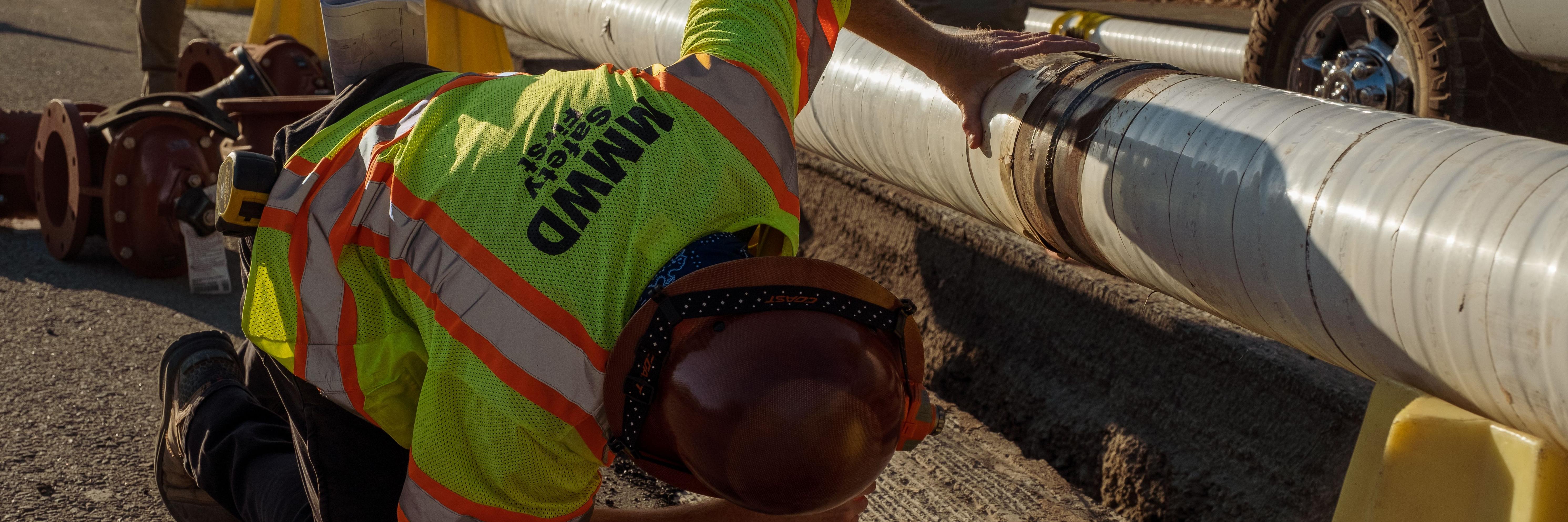 Marin Water Construction crew inspects a myelinated pipe.