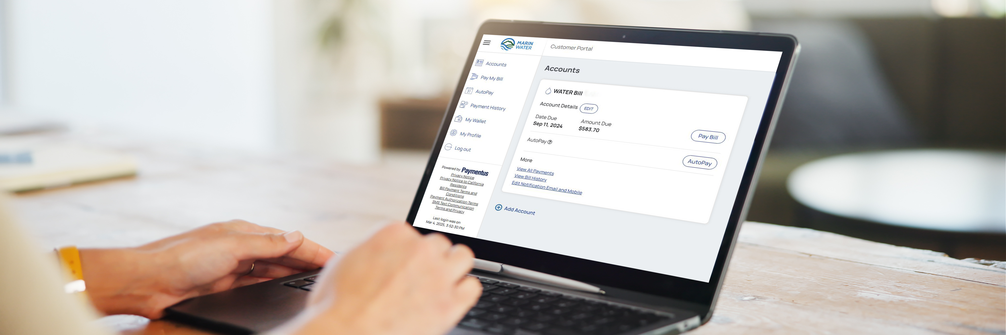 Marin Water's online bill payment system portal on a laptop screen with hands on the keyboard