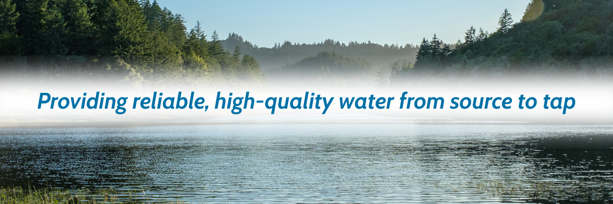 An image of a reservoir with the words "Providing reliable, high-quality water from source to tap"