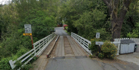 A wooden bridge surrounded by trees