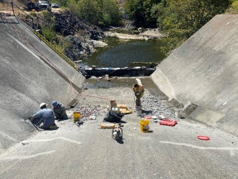 Workers and equipment in the Nicasio Dam spillway