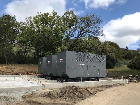 Three generators on a concrete slab