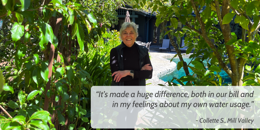 A person stands on a walkway shaded by fruit trees. At bottom right, the following text is superimposed: “It’s made a huge difference, both in our bill and in my feelings about my own water usage.”  - Collette S., Mill Valley"