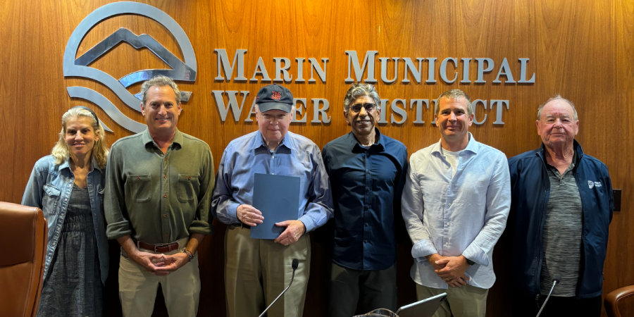 Board members pose for a photo.