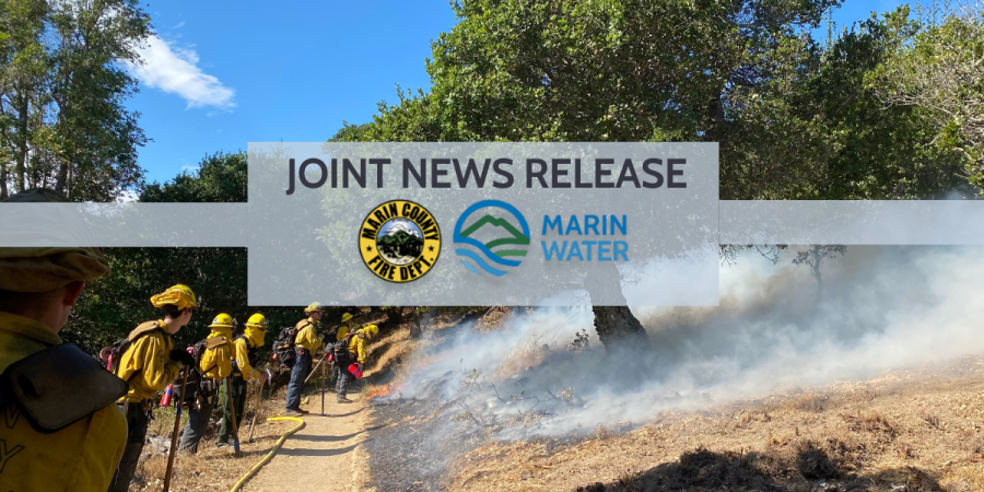 Firefighters stand at the top of an overlook behind superimposed logos for the Marin County Fire Department and Marin Water, as well as the text: "Joint News Release."
